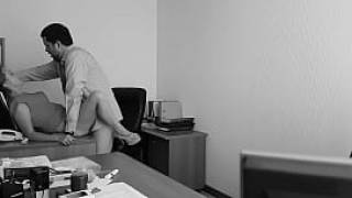 The boss fucks his employer at the office table and films it on hidden cam