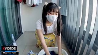 Myanmar cute girl washing her clothes