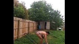Mowing grass in sexy swimsuit