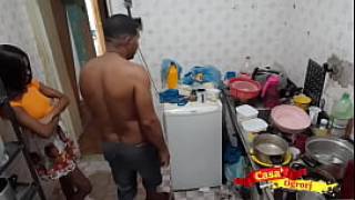 A cute little stepdaughter being fucked by her stepdad in the kitchen